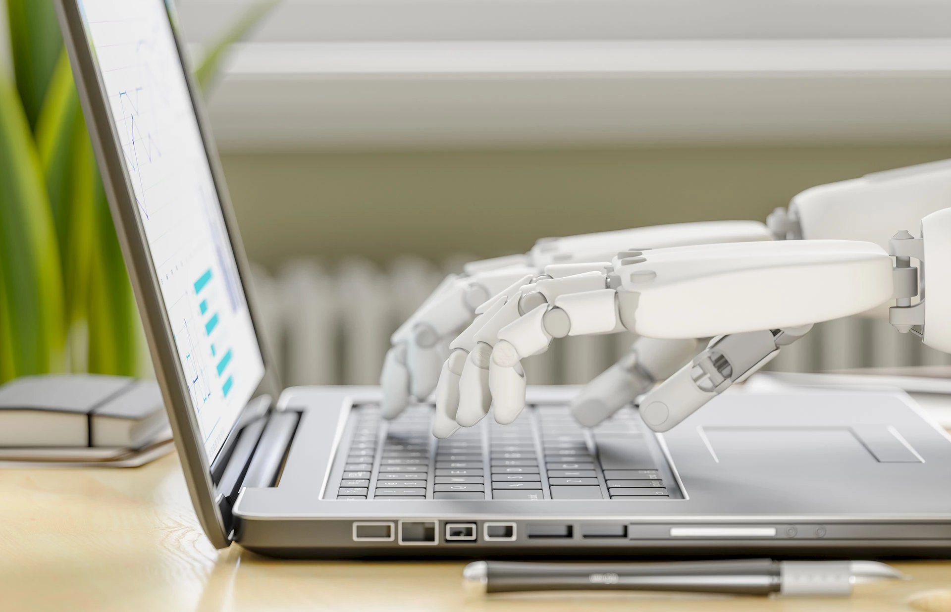 Robot’s hands typing on keyboard.